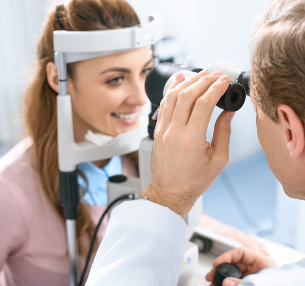 oculist-examining-patient-vision-with-slit-lamp-in-clinic.jpg